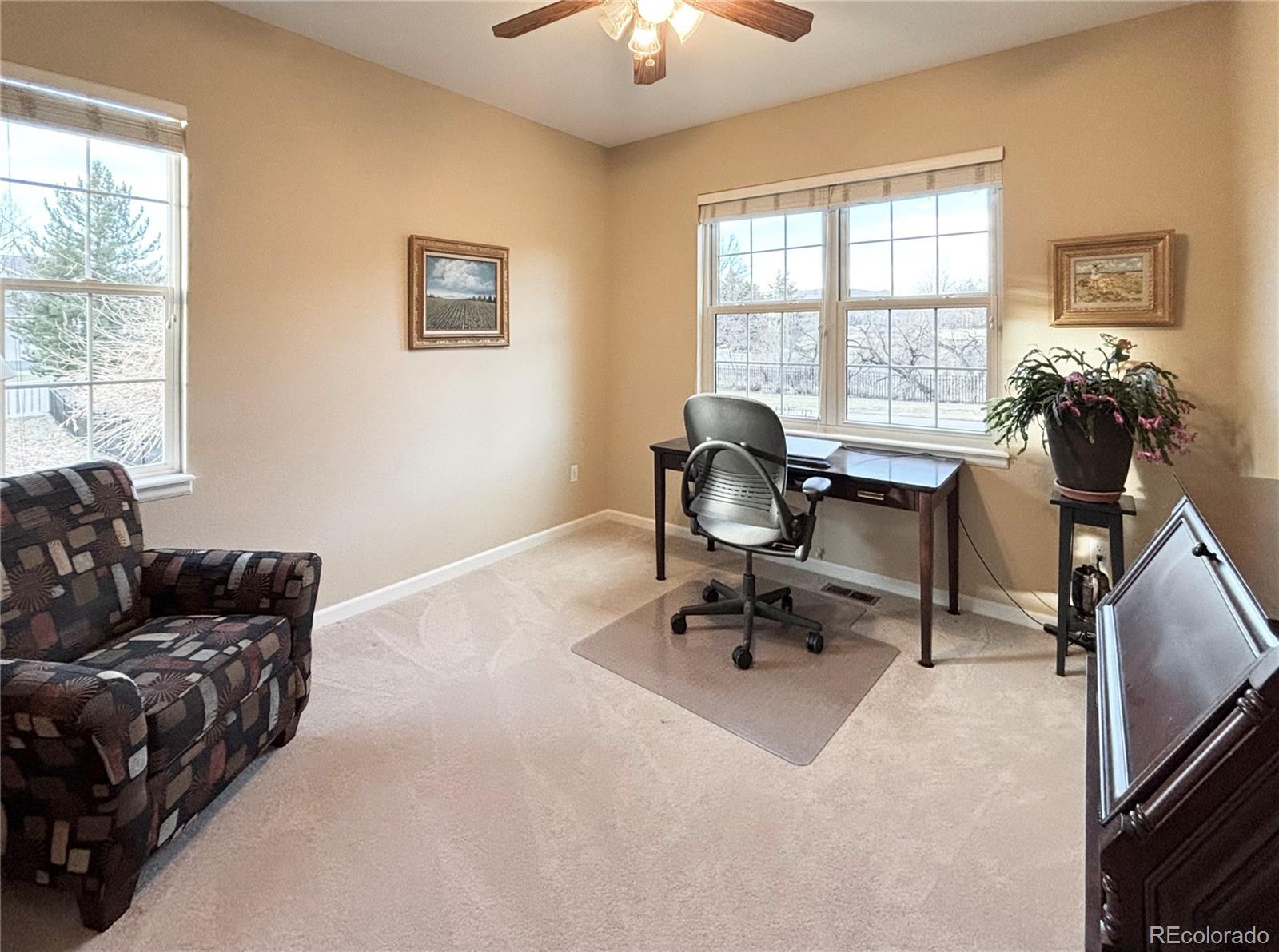6060 Deframe Court Arvada, CO 80004 - Photo 18 of 45 a living room with furniture and a window