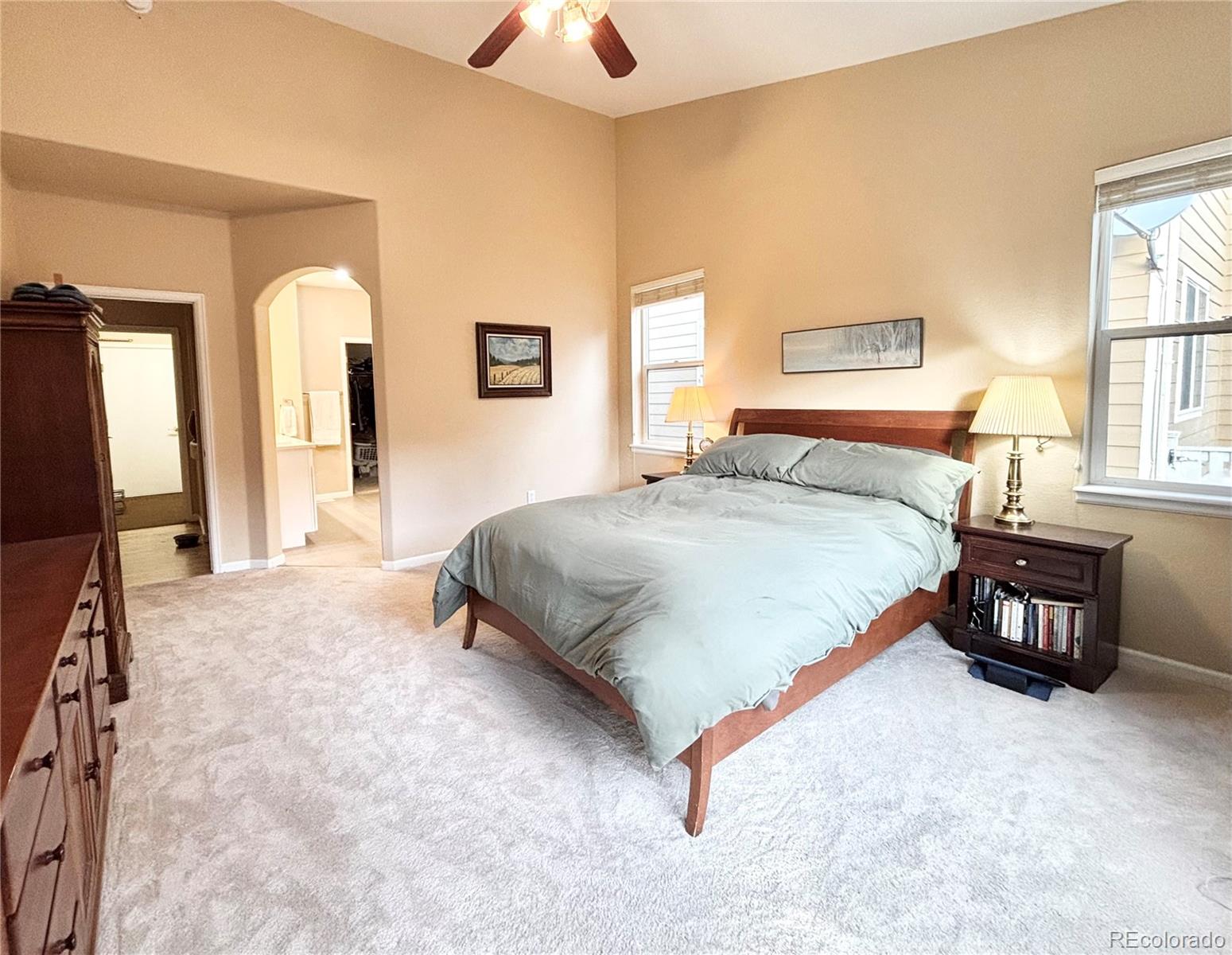 6060 Deframe Court Arvada, CO 80004 - Photo 21 of 45 a bedroom with a bed and a table in it