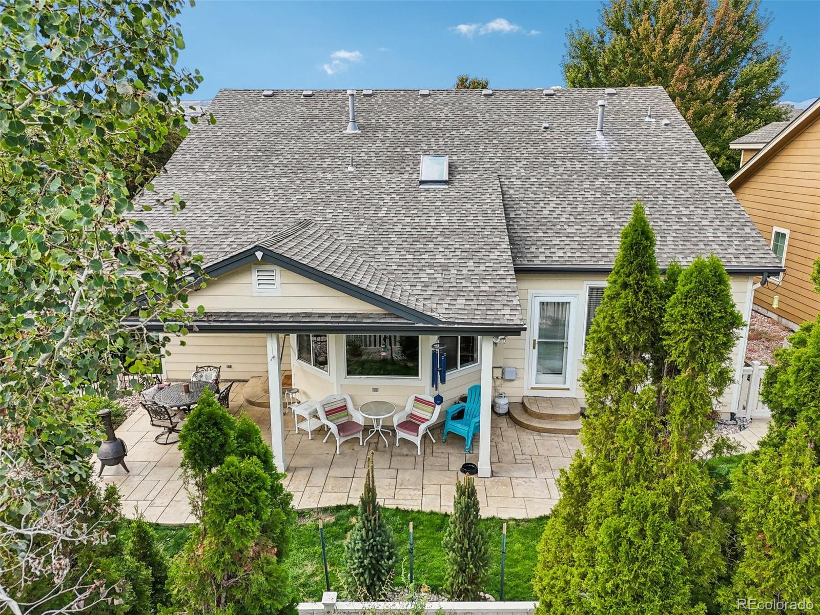 6060 Deframe Court Arvada, CO 80004 - Photo 41 of 45 an aerial view of a house with yard and outdoor seating