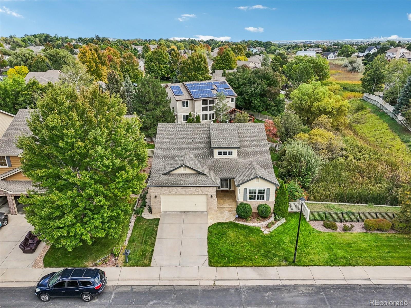 6060 Deframe Court Arvada, CO 80004 - Photo 43 of 45 an aerial view of a house with a garden