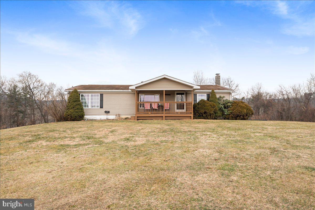 230 Cedar Flat Road Warfordsburg, PA 17267 - Photo 1 of 44 a house with trees in the background