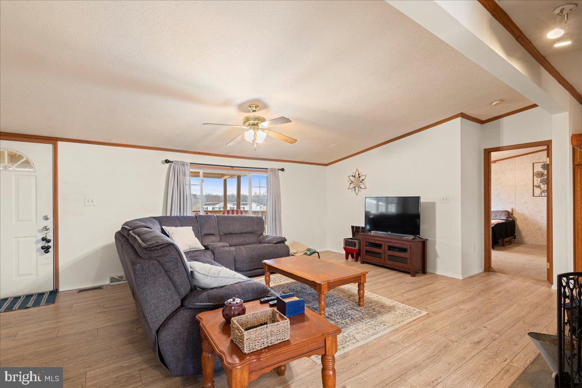 230 Cedar Flat Road Warfordsburg, PA 17267 - Photo 12 of 44 a living room with furniture and a flat screen tv