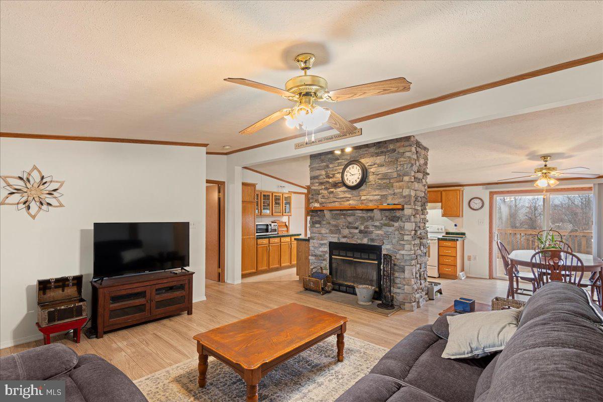 230 Cedar Flat Road Warfordsburg, PA 17267 - Photo 14 of 44 a living room with furniture and a flat screen tv