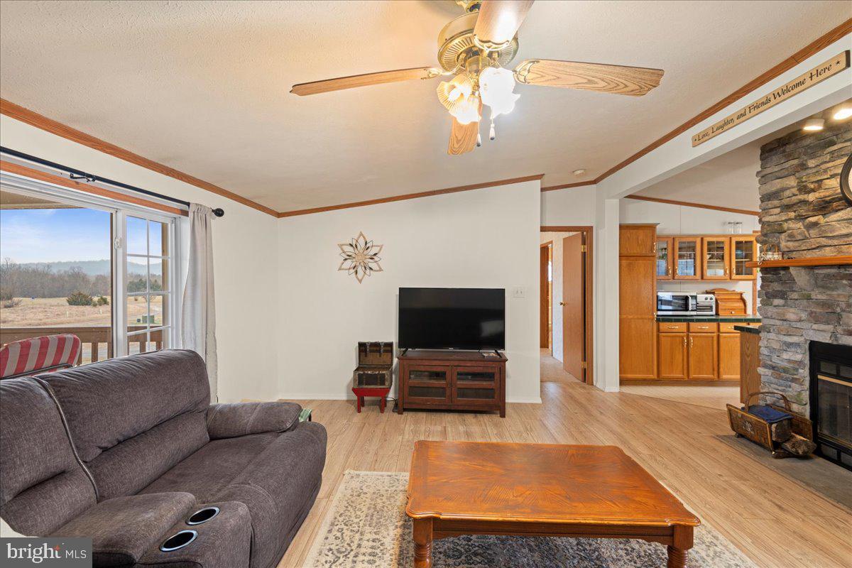 230 Cedar Flat Road Warfordsburg, PA 17267 - Photo 15 of 44 a living room with furniture and a flat screen tv