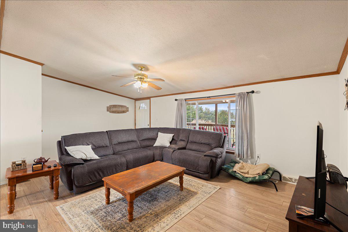 230 Cedar Flat Road Warfordsburg, PA 17267 - Photo 16 of 44 a living room with furniture and a flat screen tv