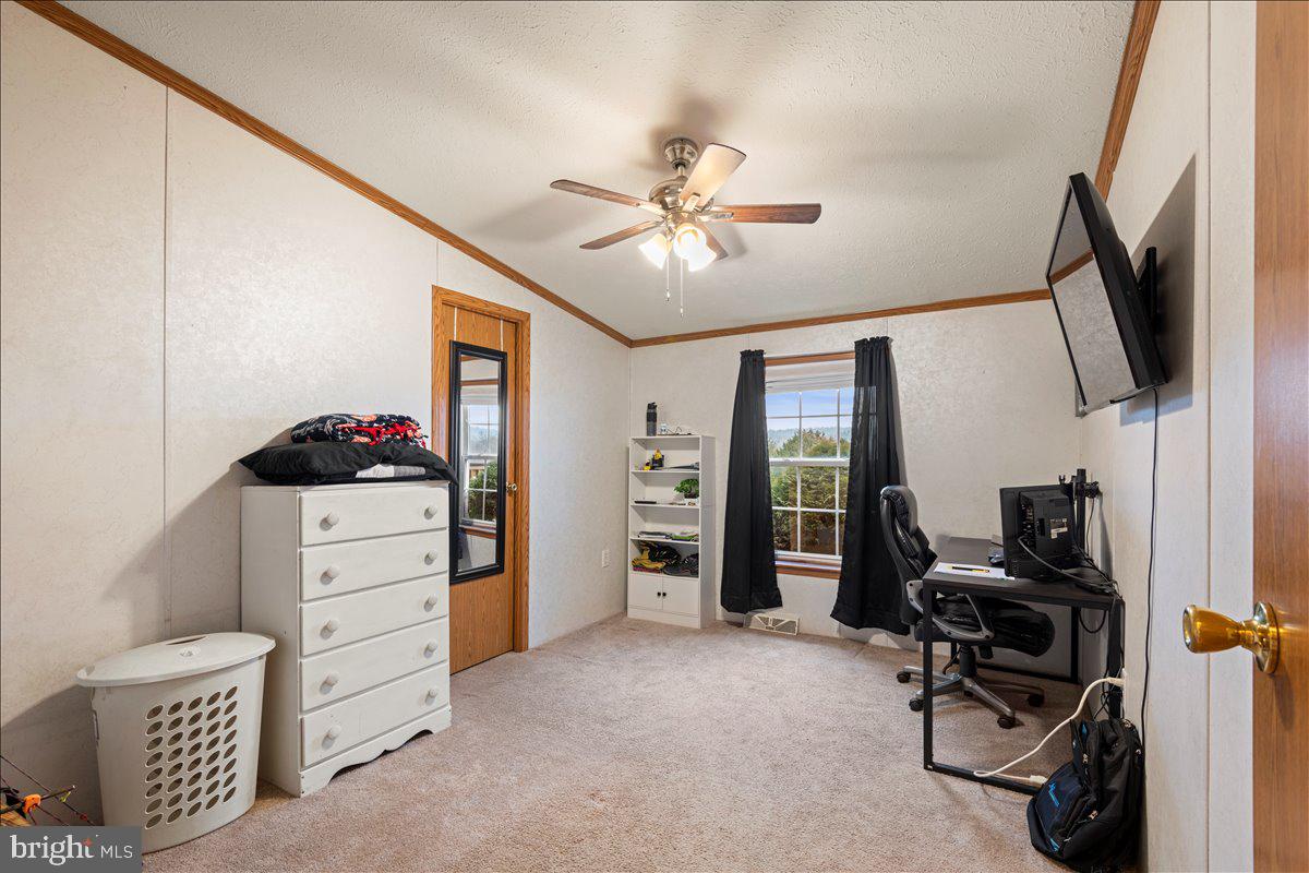 230 Cedar Flat Road Warfordsburg, PA 17267 - Photo 24 of 44 a view of a workspace with furniture and a window