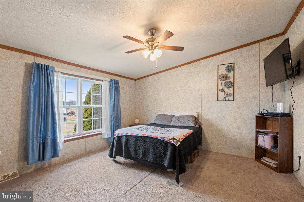 230 Cedar Flat Road Warfordsburg, PA 17267 - Photo 26 of 44 a bedroom with a bed flat screen tv and a window