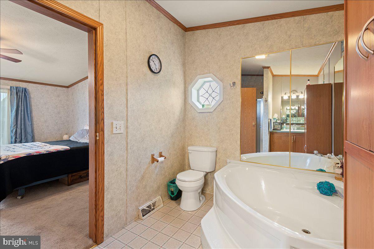 230 Cedar Flat Road Warfordsburg, PA 17267 - Photo 31 of 44 a bathroom with a sink a toilet and shower