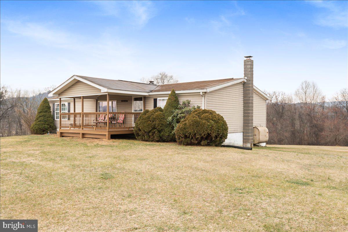 230 Cedar Flat Road Warfordsburg, PA 17267 - Photo 38 of 44 a front view of a house with a yard and garage