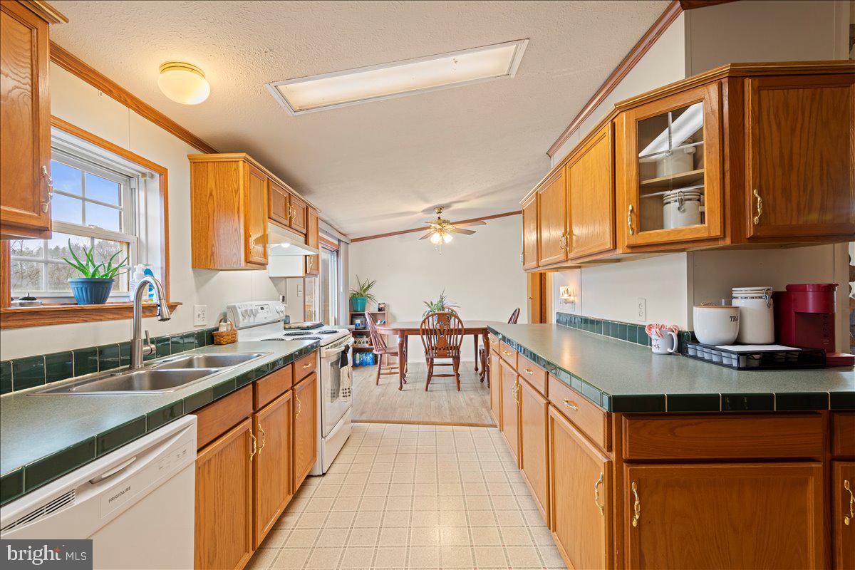 230 Cedar Flat Road Warfordsburg, PA 17267 - Photo 4 of 44 a kitchen with stainless steel appliances granite countertop a sink and cabinets