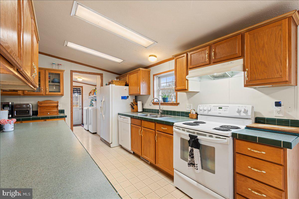 230 Cedar Flat Road Warfordsburg, PA 17267 - Photo 6 of 44 a kitchen with stainless steel appliances granite countertop a stove and a refrigerator