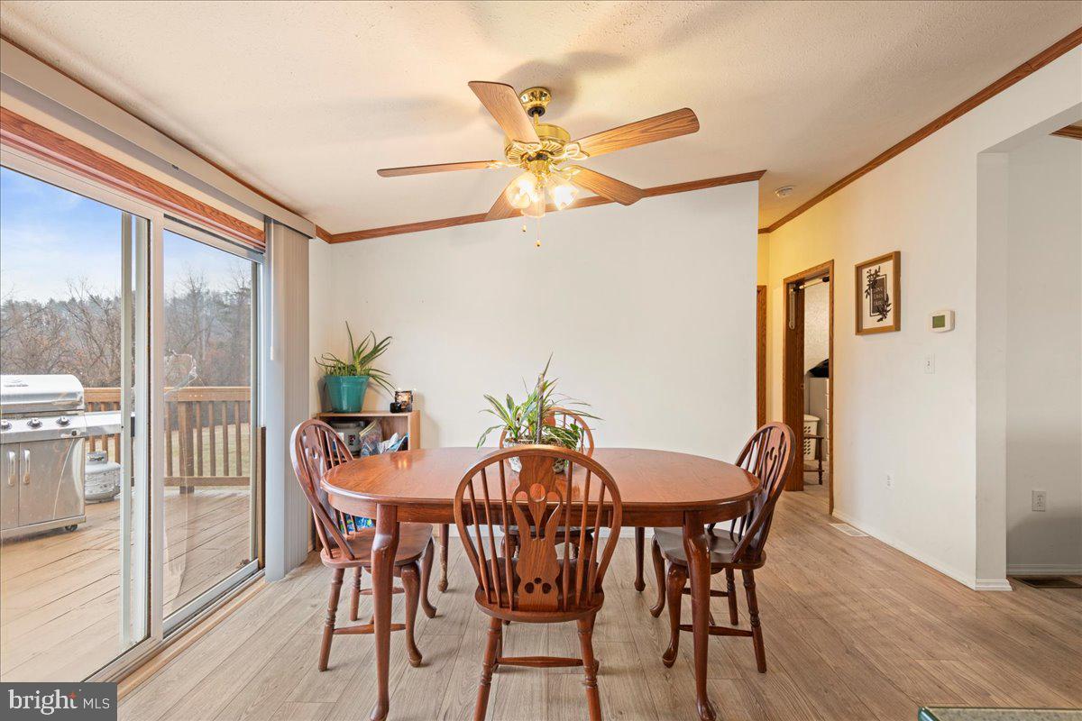 230 Cedar Flat Road Warfordsburg, PA 17267 - Photo 9 of 44 a view of a dining room with furniture and a chandelier