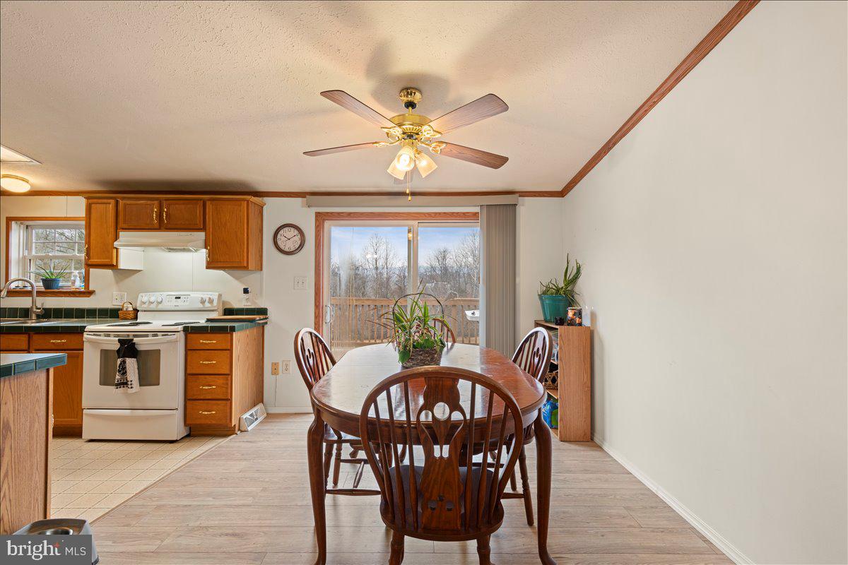 230 Cedar Flat Road Warfordsburg, PA 17267 - Photo 10 of 44 a view of a dining room with furniture window and outside view