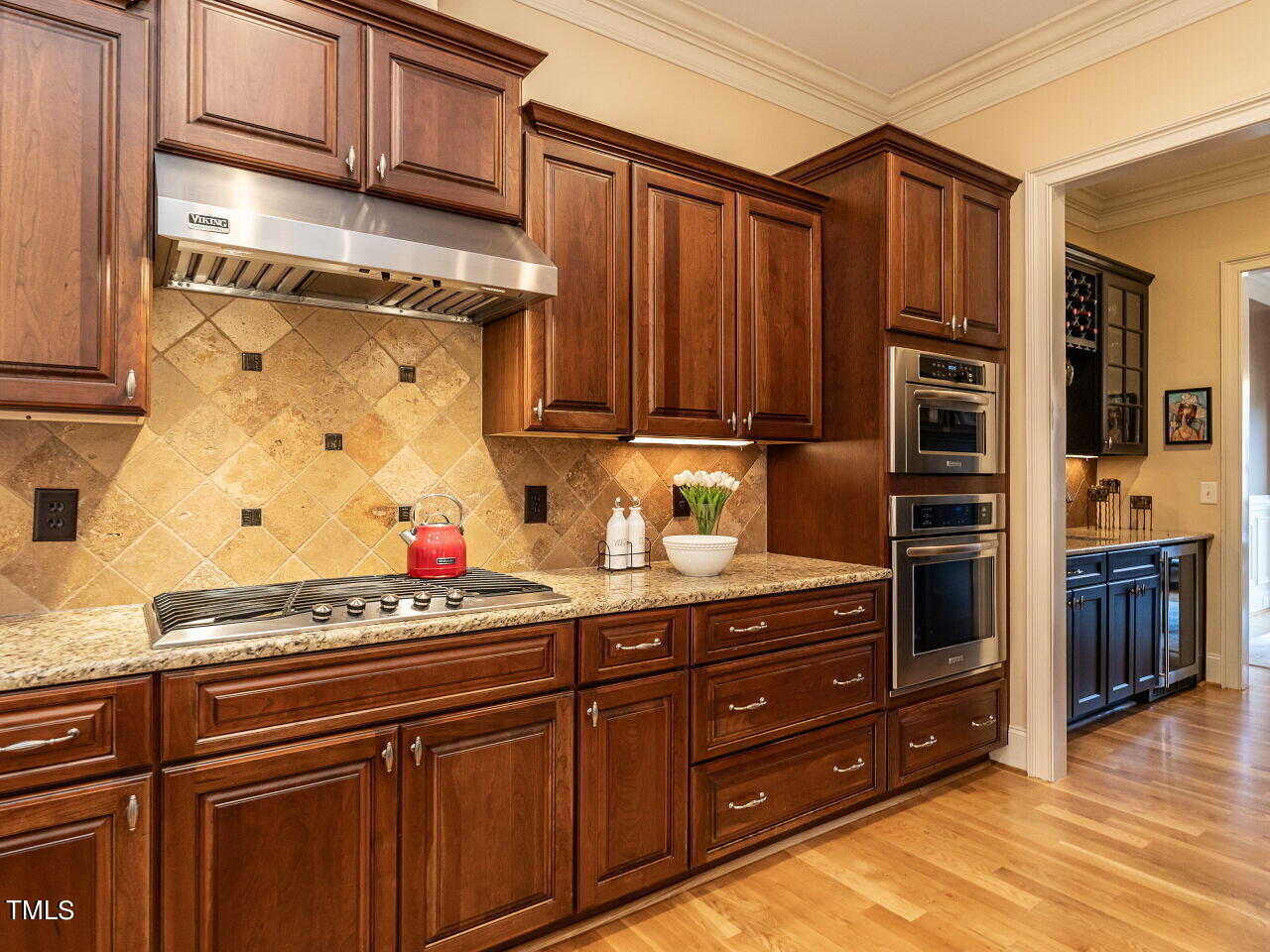 3421 Ebenezer Church Road Raleigh, NC 27612 - Photo 20 of 43 a kitchen with stainless steel appliances granite countertop a stove and cabinets