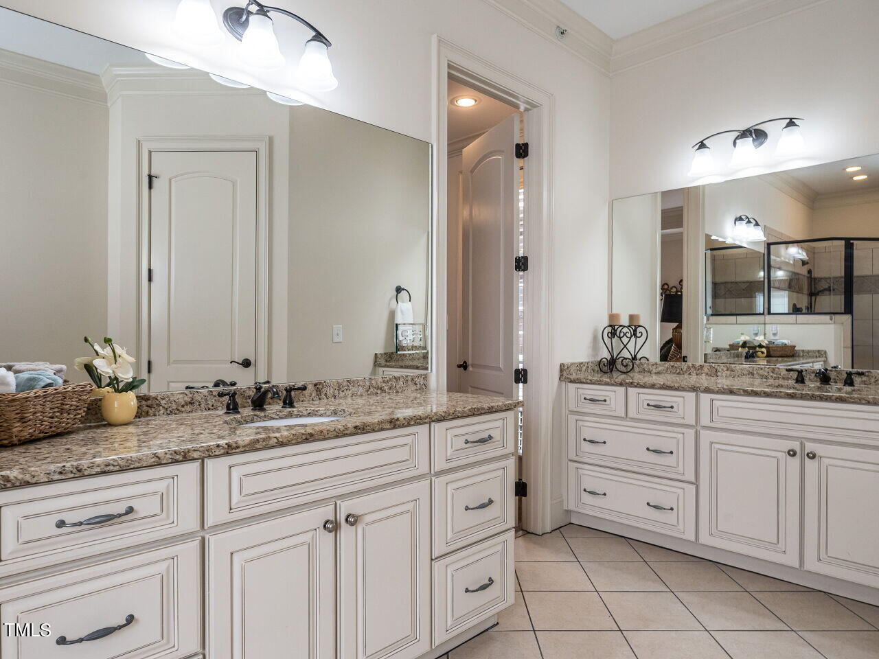 3421 Ebenezer Church Road Raleigh, NC 27612 - Photo 24 of 43 a bathroom with a granite countertop sink double and mirror