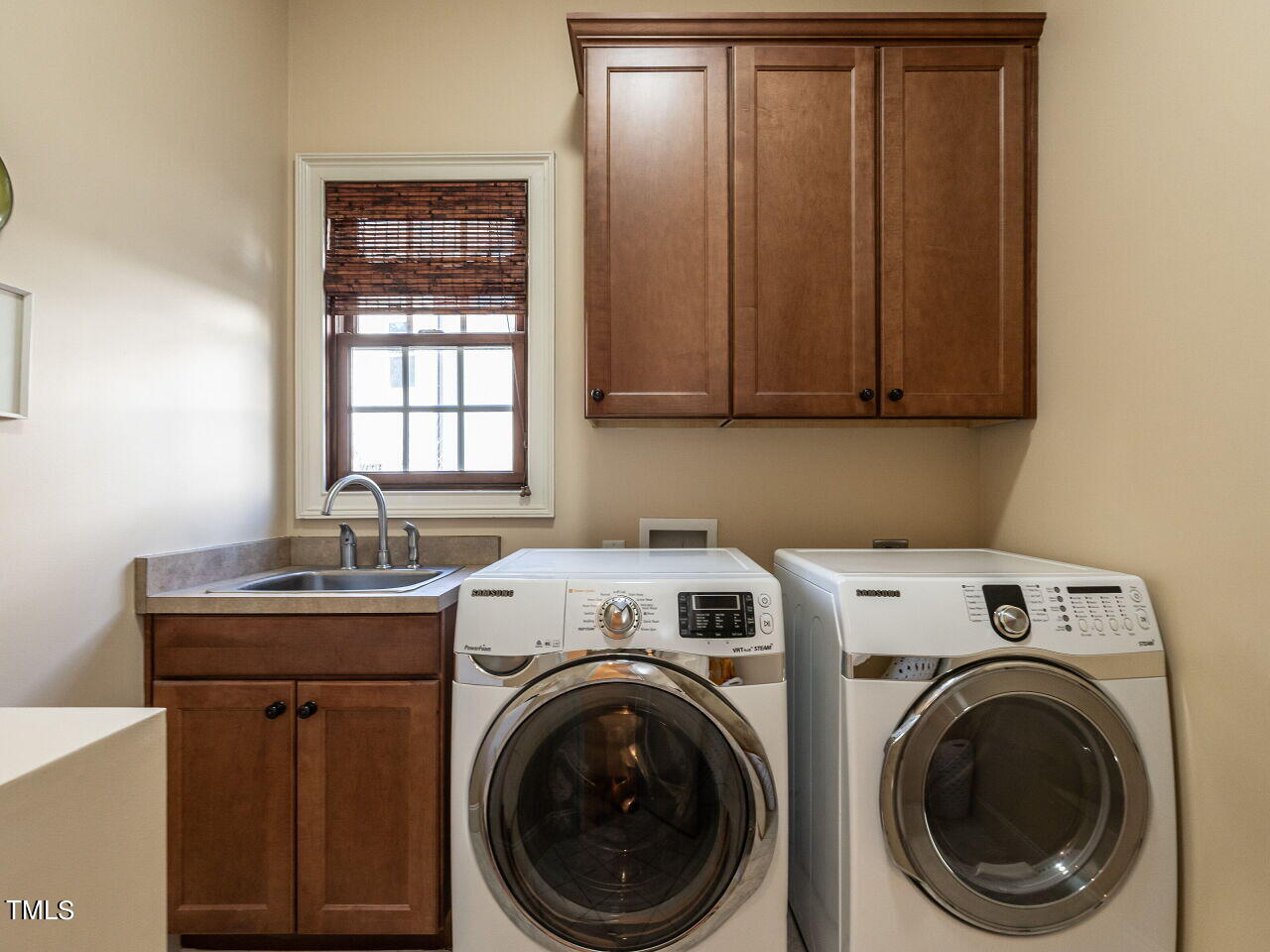 3421 Ebenezer Church Road Raleigh, NC 27612 - Photo 26 of 43 a utility room with dryer and washer