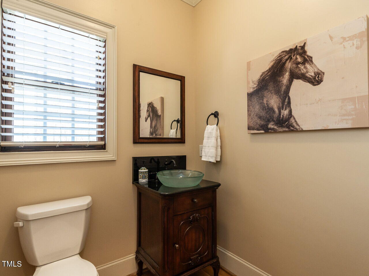 3421 Ebenezer Church Road Raleigh, NC 27612 - Photo 27 of 43 a bathroom with a toilet and a sink