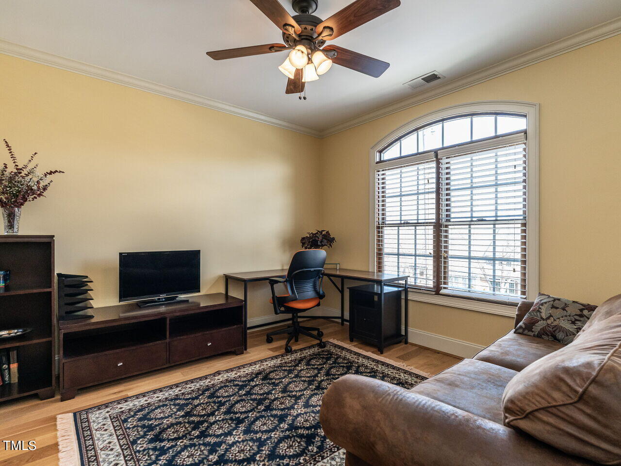 3421 Ebenezer Church Road Raleigh, NC 27612 - Photo 29 of 43 a living room with furniture and a flat screen tv
