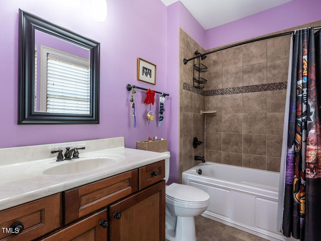 3421 Ebenezer Church Road Raleigh, NC 27612 - Photo 32 of 43 a bathroom with a sink a toilet and a bathtub