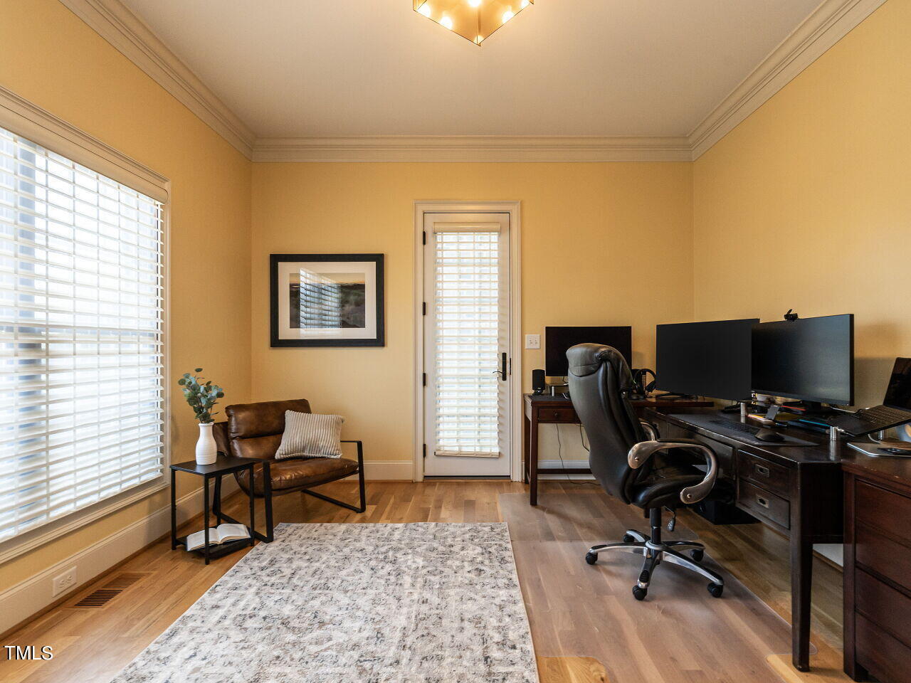 3421 Ebenezer Church Road Raleigh, NC 27612 - Photo 7 of 43 a view of a workspace with furniture and a window