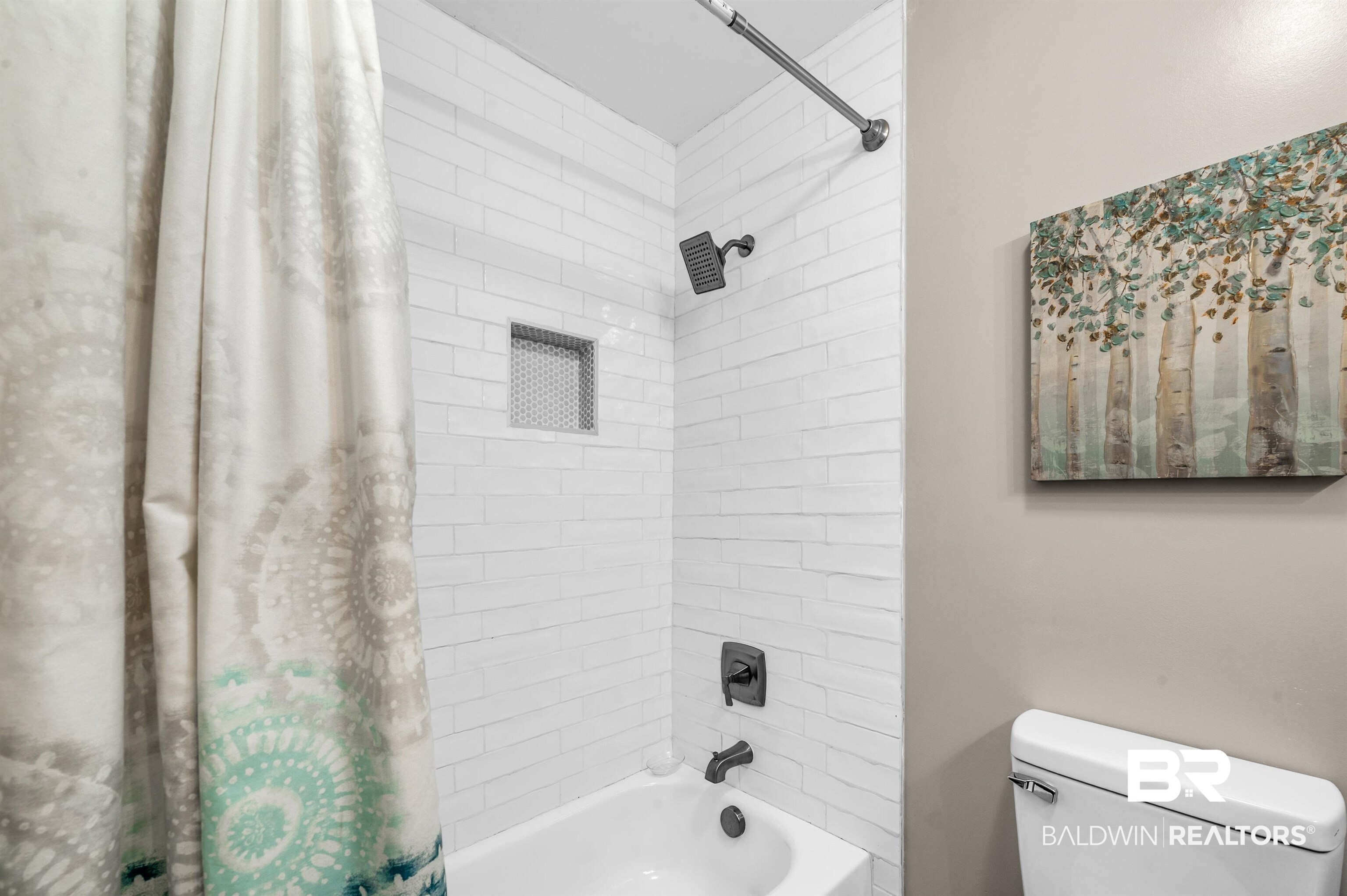 5215 Pine Road Orange Beach, AL 36561 - Photo 44 of 60 Bathroom featuring shower / bathtub combination with curtain and toilet
