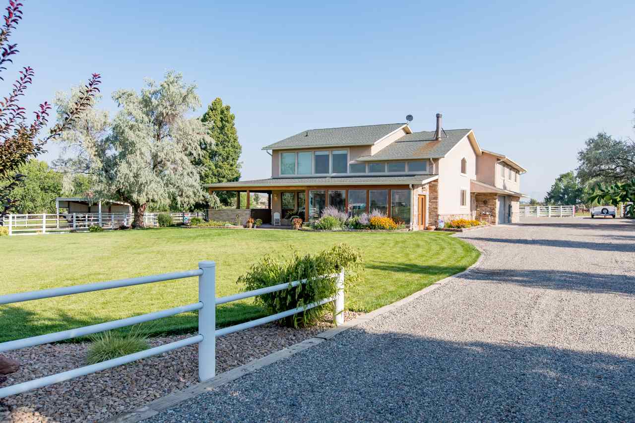 1860 L Road Fruita, CO 81521 - Photo 1 of 1 a front view of a house with a yard