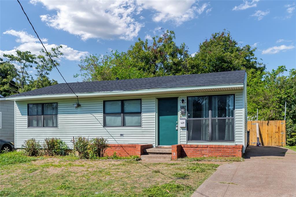 1007 Epenard Street Dallas, TX 75211 - Photo 1 of 1 a front view of a house with a yard