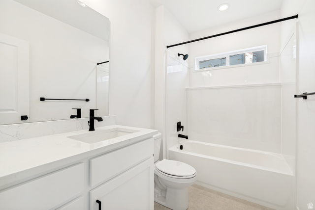1351 Maple Circle Santaquin, UT 84655 - Photo 36 of 42 Contemporary bathroom featuring a white vanity with an integrated sink and quartz countertop, matte black fixtures, a white shower/tub combination with a transom window, and recessed lighting
