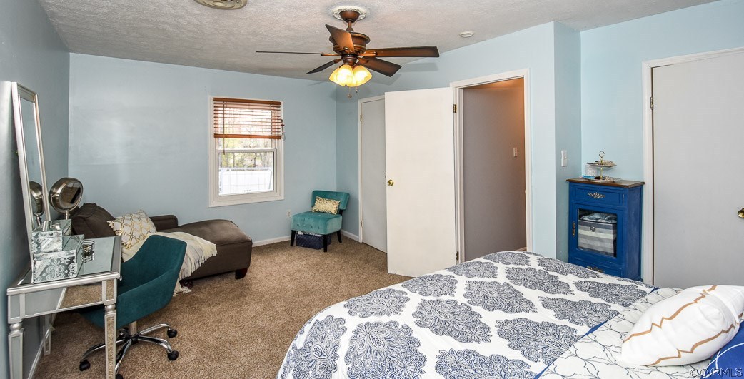 2612 Colgrave Road Midlothian, VA 23112 - Photo 19 of 33 a bedroom with a bed and a chandelier