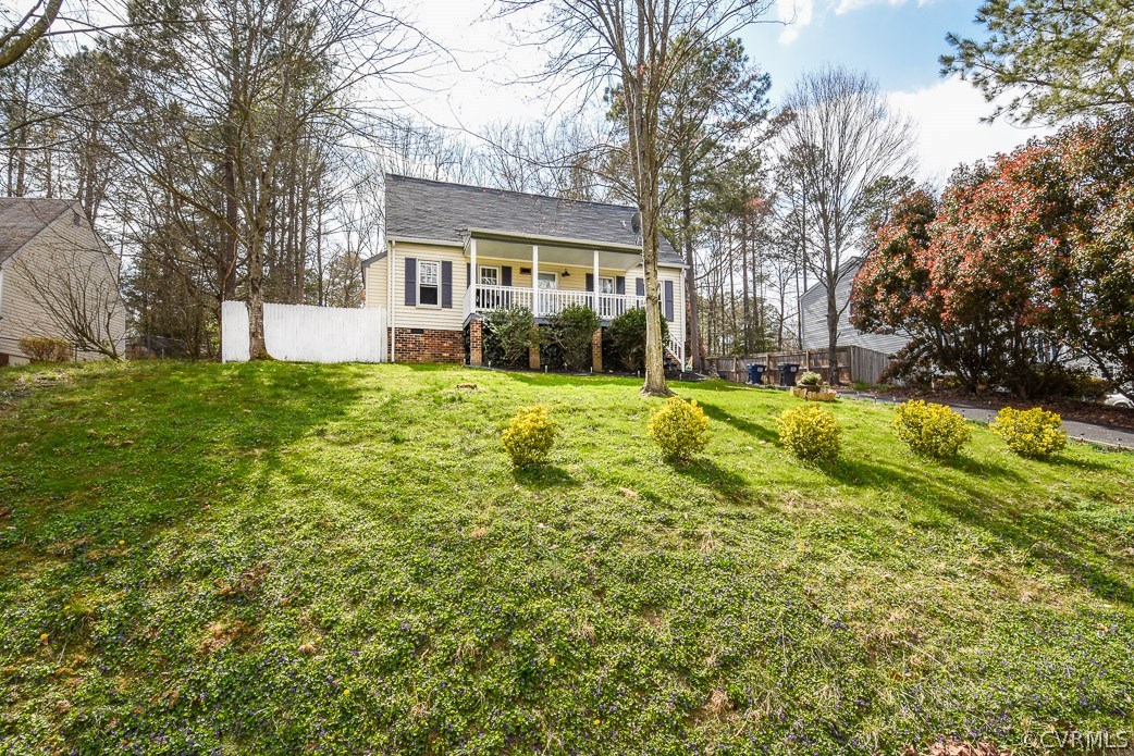 2612 Colgrave Road Midlothian, VA 23112 - Photo 6 of 33 a view of a house with a big yard and large trees