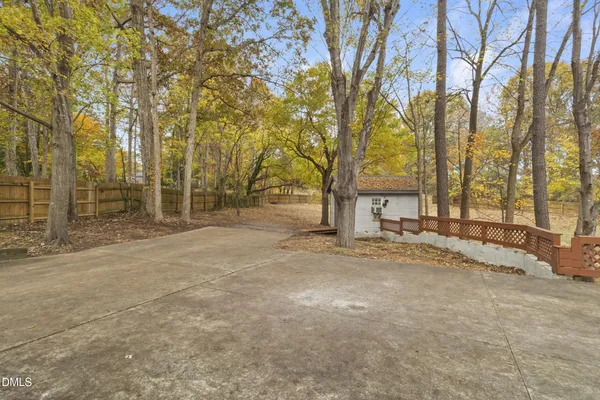 a view of a house with trees in the background