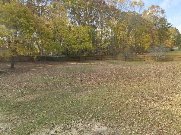 a view of a yard with a tree