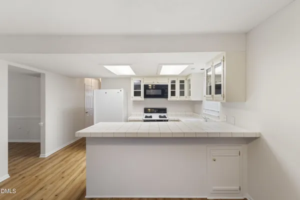 a view of kitchen with wooden floor
