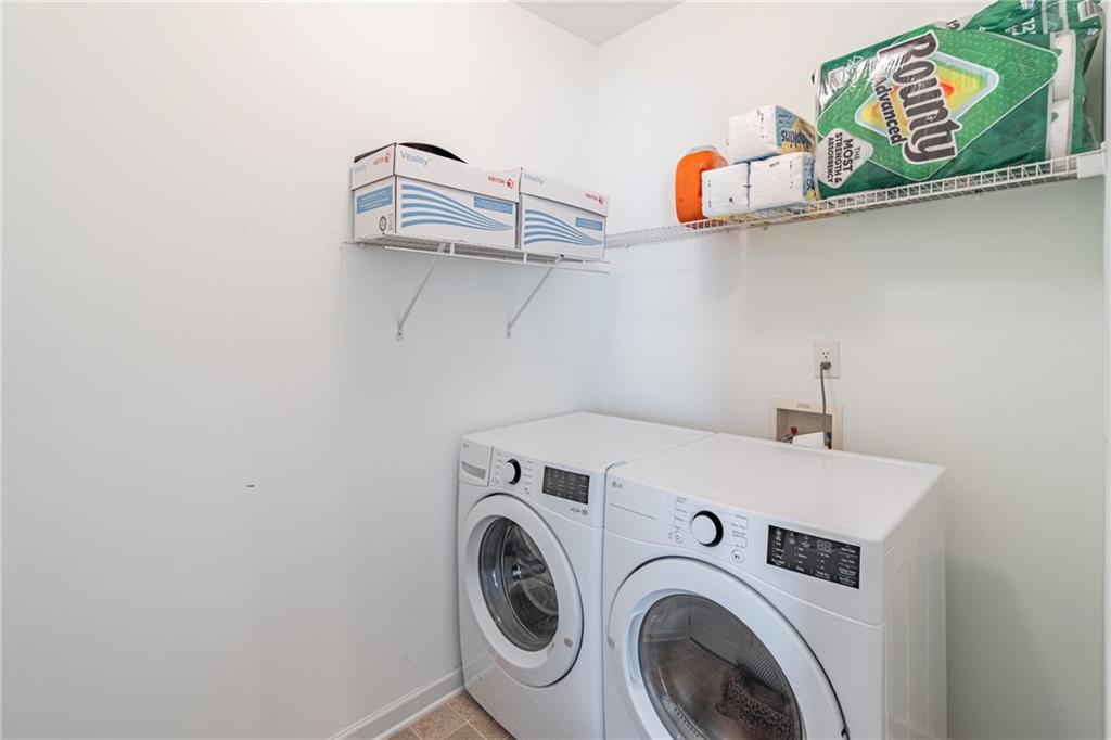 3487 Harvest Ridge Lane Northeast Buford, GA 30519 - Photo 17 of 34 a utility room with dryer and washer
