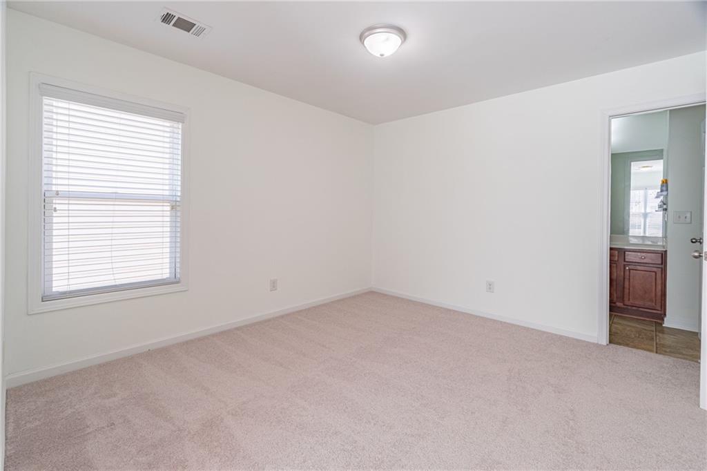 3487 Harvest Ridge Lane Northeast Buford, GA 30519 - Photo 25 of 34 an empty room with a window