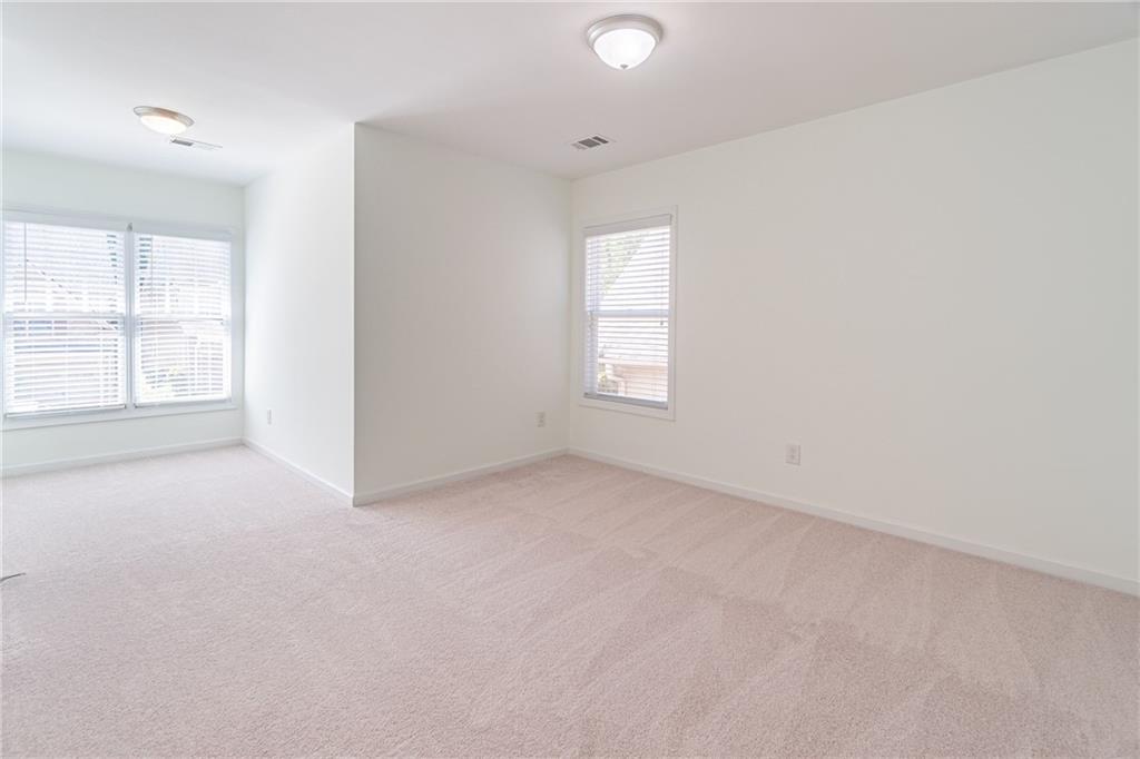 3487 Harvest Ridge Lane Northeast Buford, GA 30519 - Photo 26 of 34 an empty room with windows