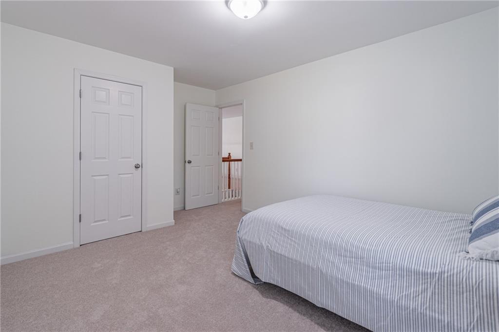 3487 Harvest Ridge Lane Northeast Buford, GA 30519 - Photo 29 of 34 a room with a bed and a closet