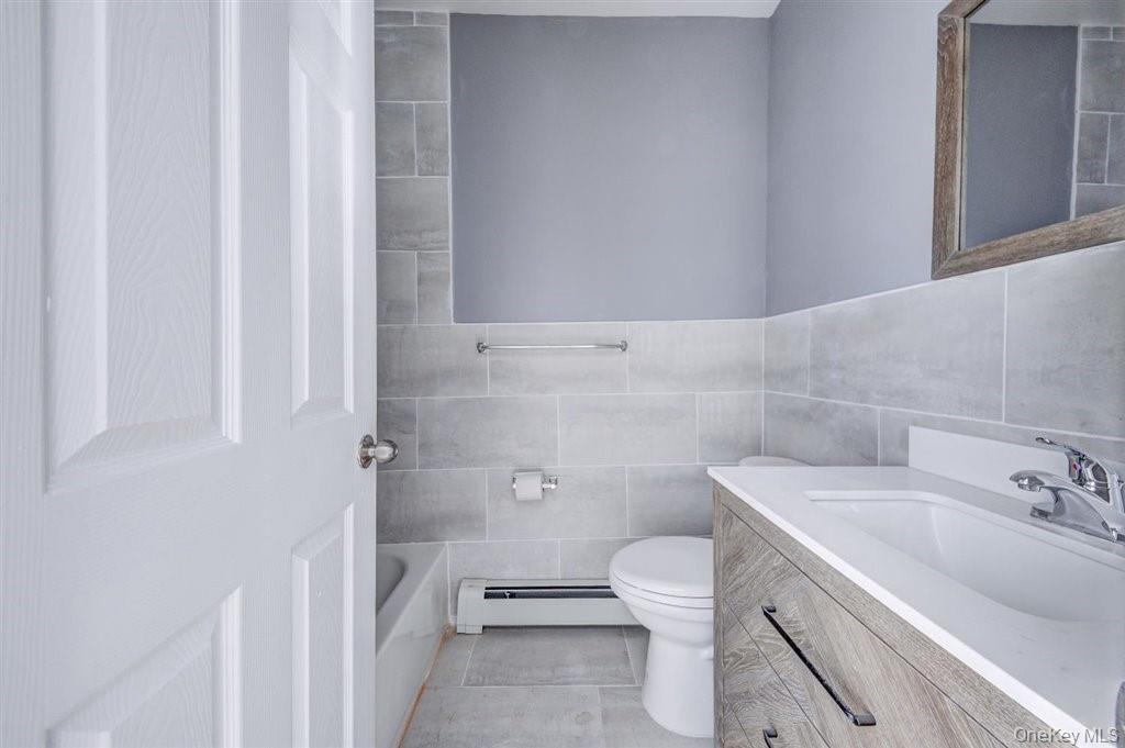 93 South Lander Street, Unit 2 Newburgh, NY 12550 - Photo 17 of 21 a bathroom with a sink toilet and shower