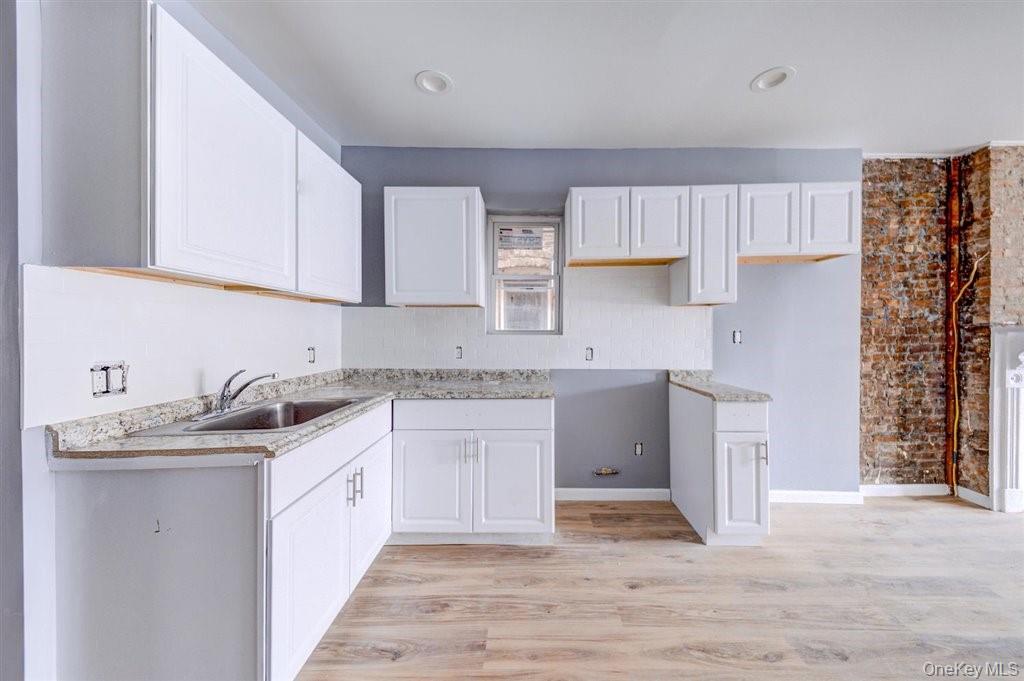 93 South Lander Street, Unit 2 Newburgh, NY 12550 - Photo 7 of 21 a kitchen with a sink stove and cabinets