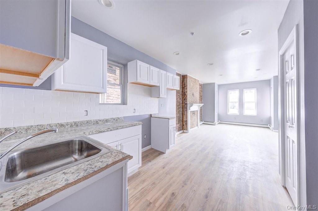 93 South Lander Street, Unit 2 Newburgh, NY 12550 - Photo 8 of 21 a kitchen with a sink stove and refrigerator