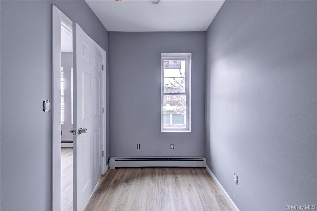 93 South Lander Street, Unit 2 Newburgh, NY 12550 - Photo 10 of 21 an empty room with wooden floor and a window