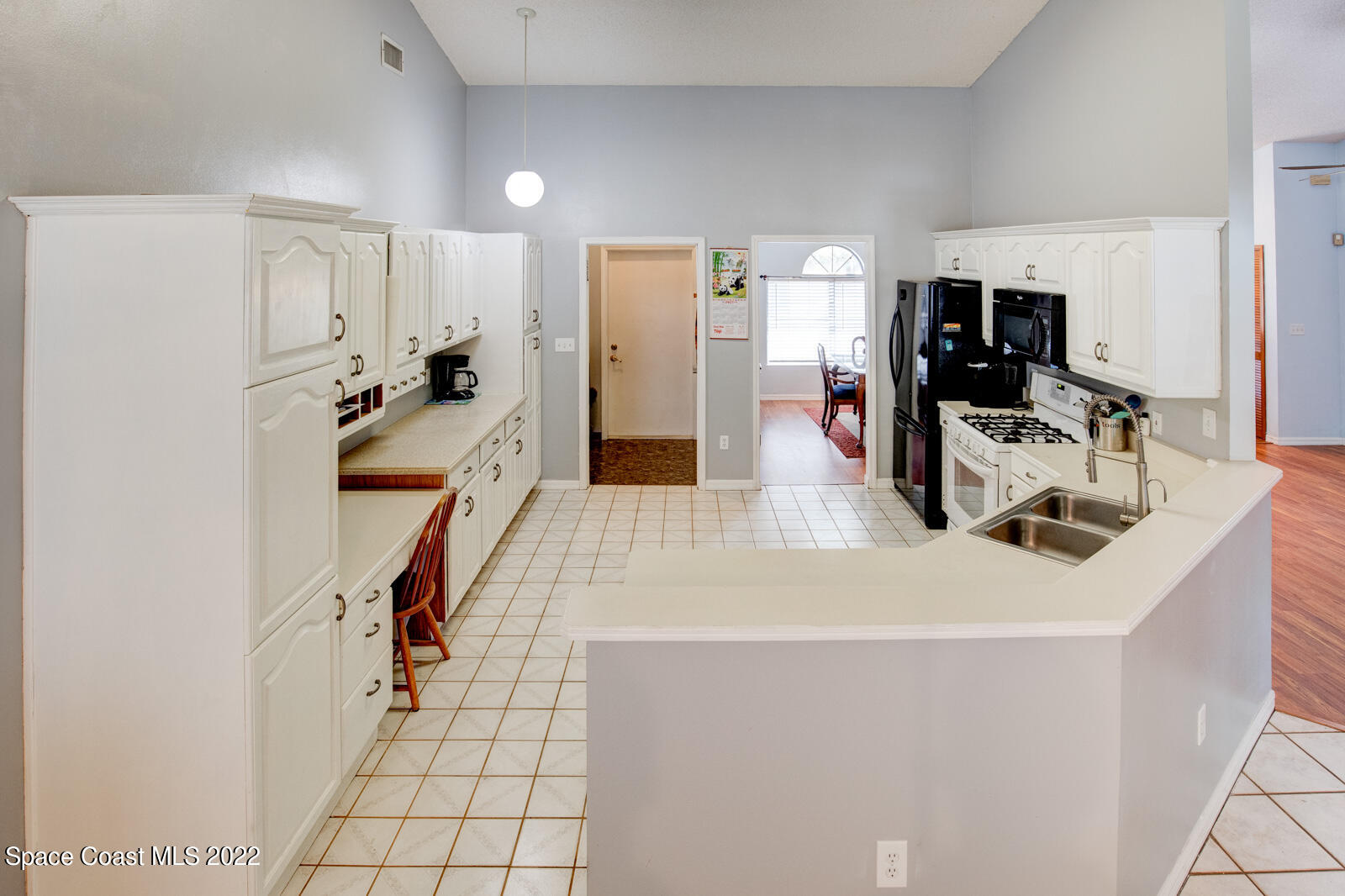 1250 North Carpenter Road Titusville, FL 32796 - Photo 14 of 52 a kitchen with a sink appliances and a counter top space