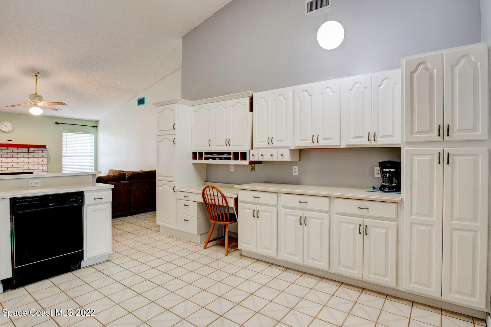 1250 North Carpenter Road Titusville, FL 32796 - Photo 17 of 52 a kitchen with stainless steel appliances granite countertop a sink and cabinets