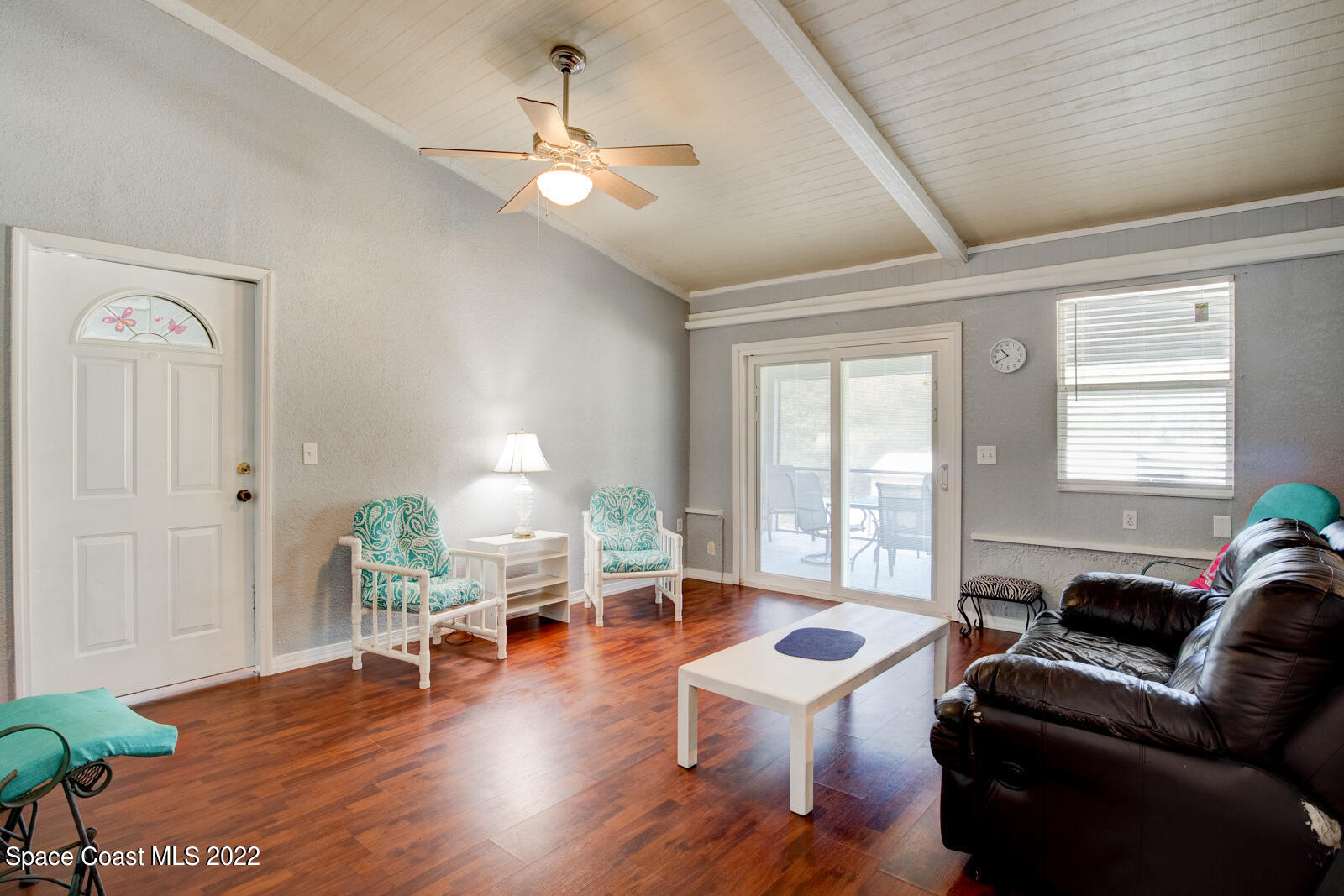 1250 North Carpenter Road Titusville, FL 32796 - Photo 19 of 52 a living room with furniture and wooden floor
