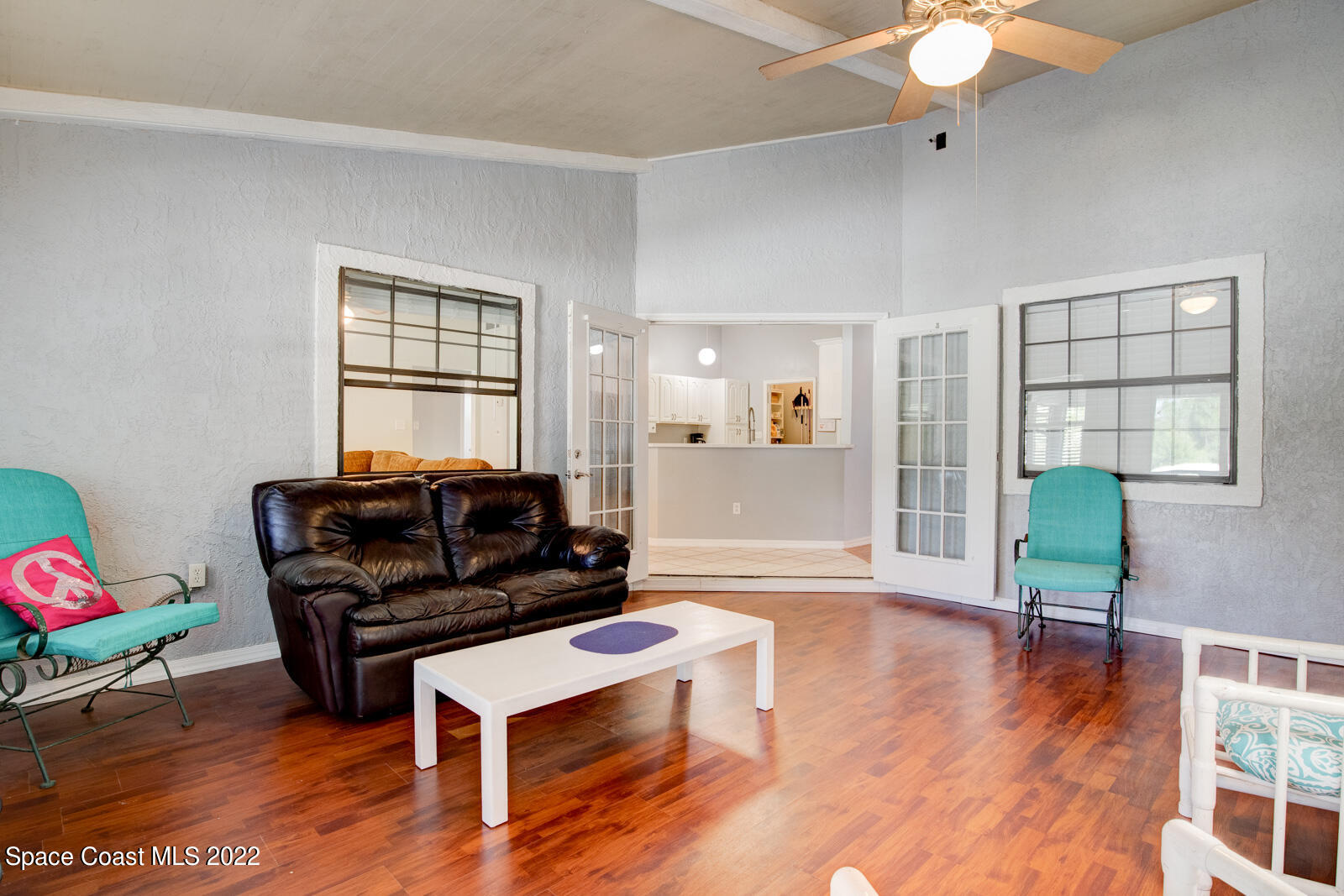 1250 North Carpenter Road Titusville, FL 32796 - Photo 20 of 52 a living room with furniture and a wooden floor