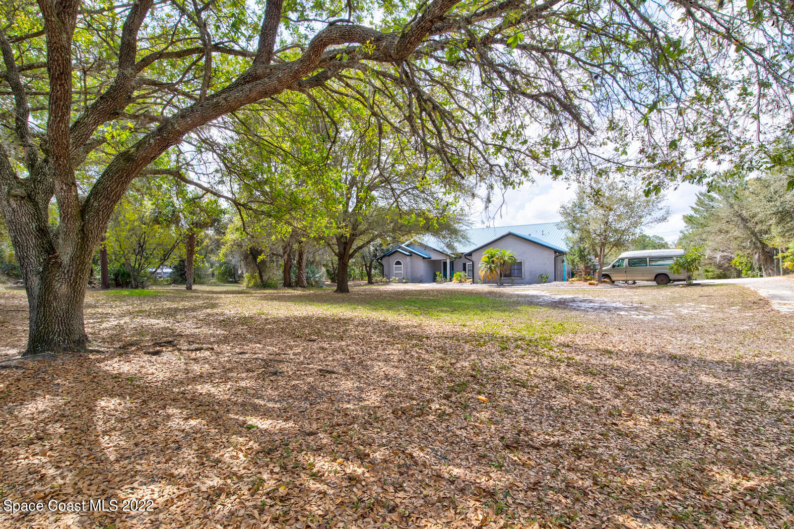 1250 North Carpenter Road Titusville, FL 32796 - Photo 3 of 52 a view of outdoor space with trees all around