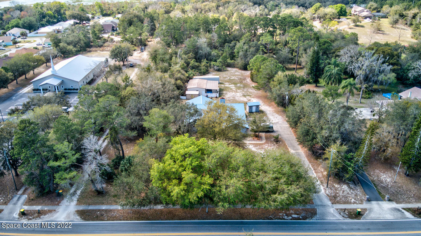 1250 North Carpenter Road Titusville, FL 32796 - Photo 45 of 52 an aerial view of multiple house