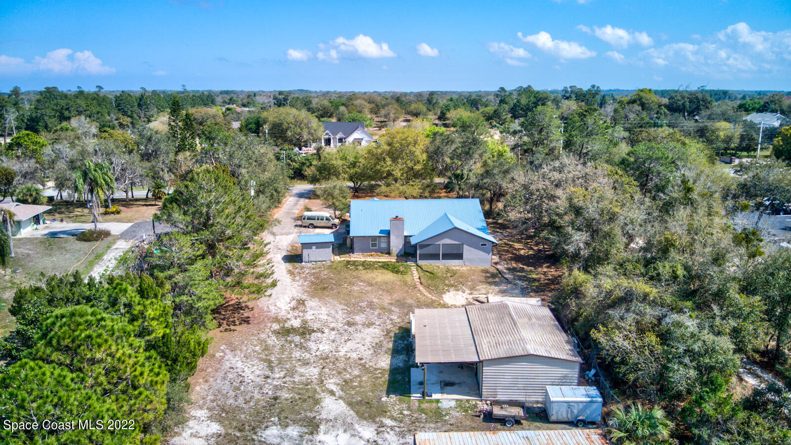 1250 North Carpenter Road Titusville, FL 32796 - Photo 47 of 52 a view of a house with a yard and lake view