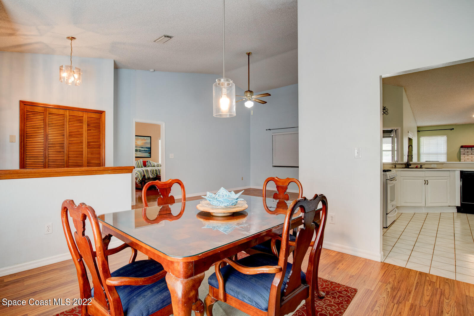 1250 North Carpenter Road Titusville, FL 32796 - Photo 8 of 52 a view of a dining room with furniture and wooden floor