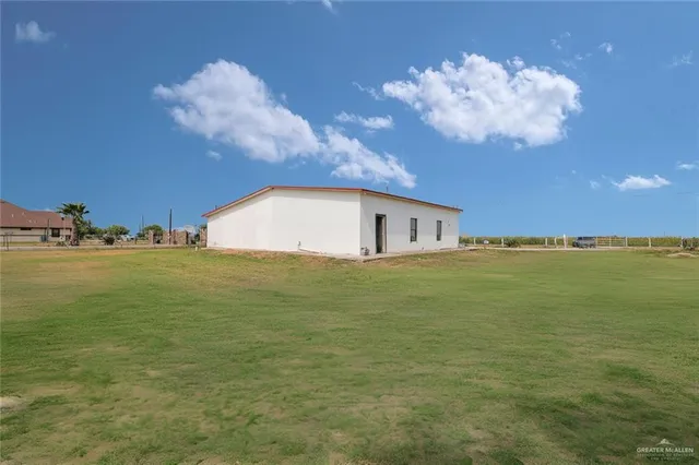 a view of a house with a big yard